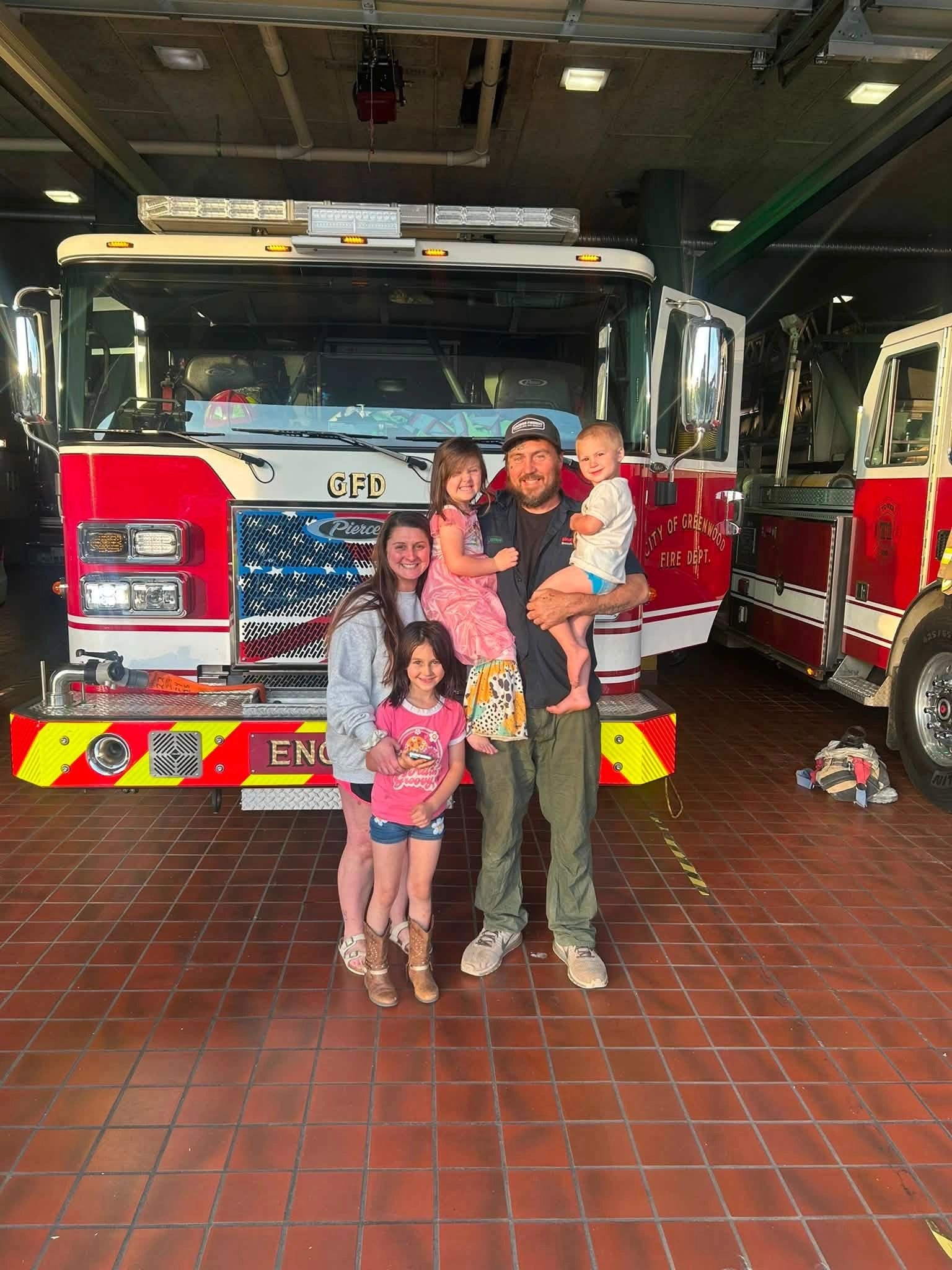 Firefighter family at fire station